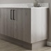 Light grey oak return plinth fitted with base cabinet and white worktop
