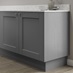 Grained slate grey continuous MFC plinth fitted with base cabinet and white worktop