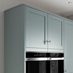 Grained Seafoam 18mm Tower Decor End shown with Cabinets and Ovens