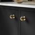 Beehive Satin Brass Cabinet Knob on Kitchen Cupboards Close Up