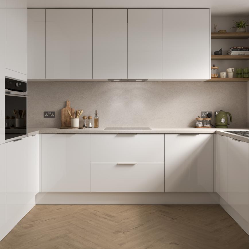 A gloss white kitchen from the Greenwich range, in a U-shaped layout with integrated appliances and matching wall cabinets.