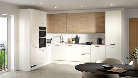 A porcelain kitchen from the Winterton collection. It has a gloss finish, an l-shaped layout, and natural oak wall cabinetry.