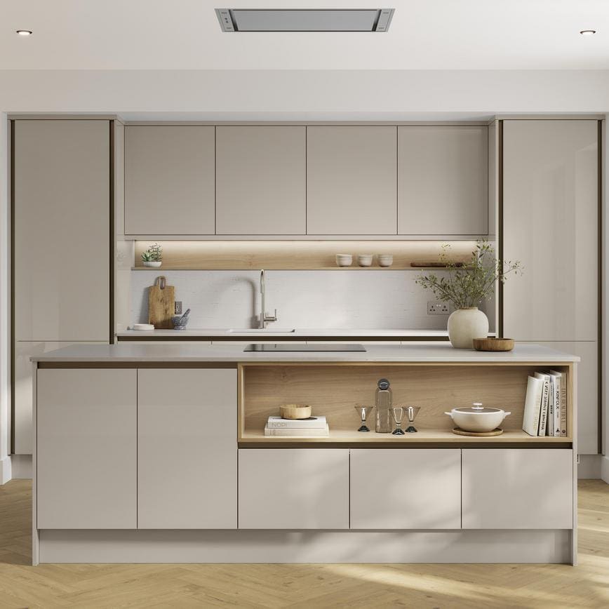 A cream, sandstone kitchen in a gloss finish and handlelss cabinets. It has light oak flooring, with a kitchen island.