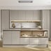 A cream, sandstone kitchen in a gloss finish and handlelss cabinets. It has light oak flooring, with a kitchen island.