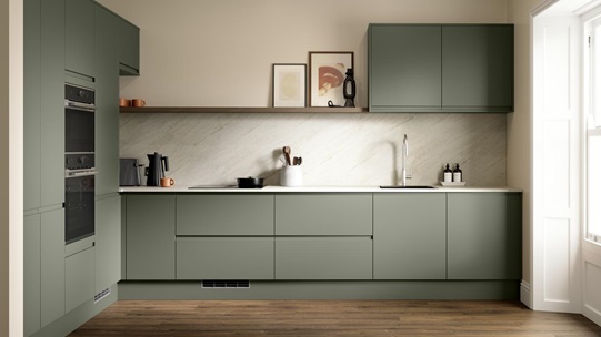 A modern dark ash green kitchen with integrated handles. It is in an l-shape layout with white stone worktops and back panel. 