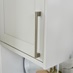 Bickern Brushed Nickel Cupboard Handle vertically mounted on a wall cabinet