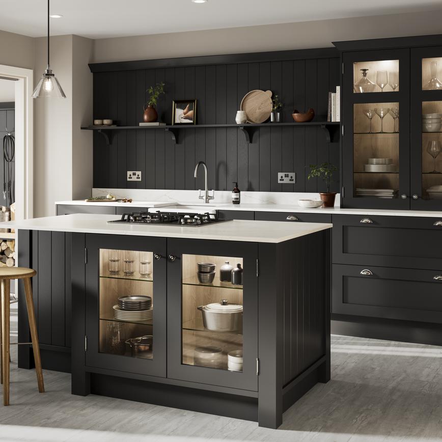 Black shaker kitchen island with matching wall panels and glass cabinets. Includes white worktops for a two-tone look.