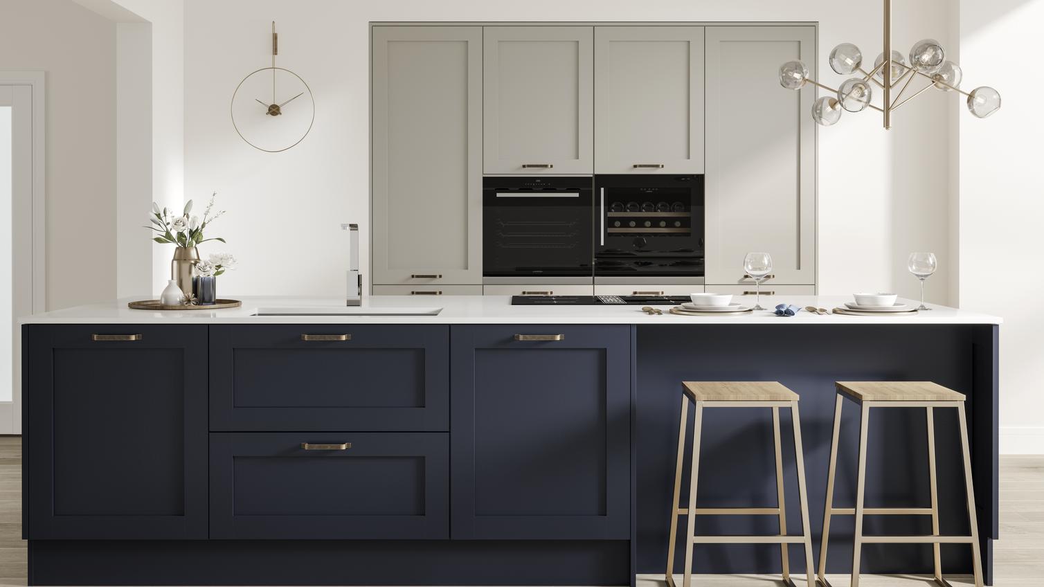 A mix and match blue kitchen idea with cream units and a navy island. Has shaker doors, timber floors, and a breakfast bar.