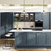 A timeless blue kitchen with shaker cupboard doors, white worktops, wooden floors, and brass knobs in a peninsula layout.
