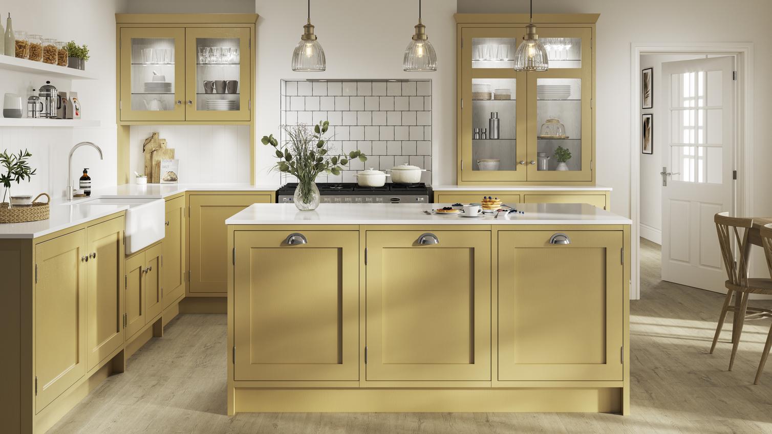 Yellow L-shaped kitchen. Includes timber shaker kitchen doors with in-frame profiles, white worktops, and chrome cup handles.