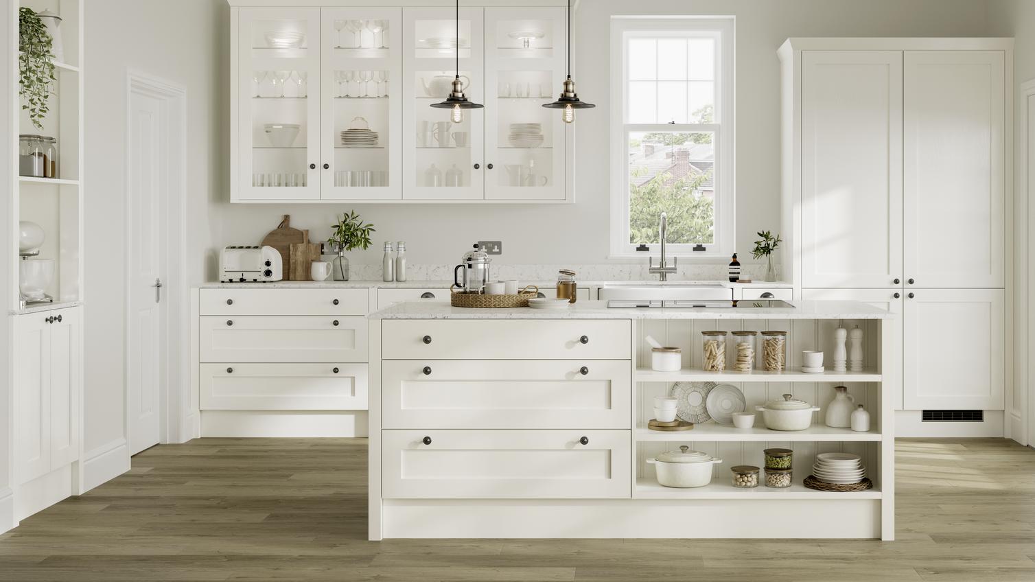White shaker kitchen idea with island in open-plan layout. Has open shelving, clear glass wall units, and black knob handles.