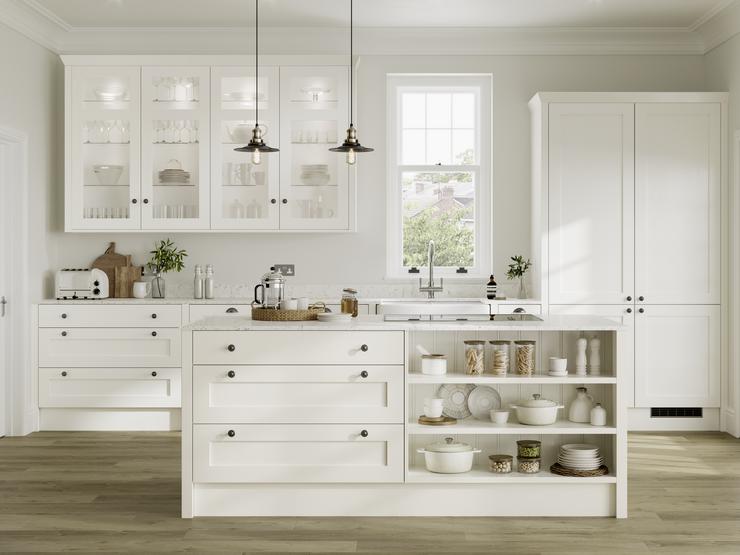 White shaker kitchen idea with island in open-plan layout. Has open shelving, clear glass wall units, and black knob handles.