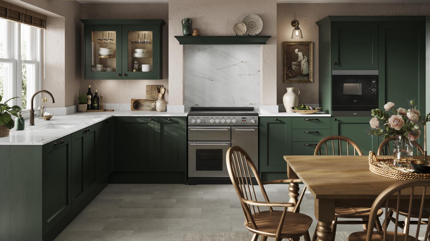A dark, fir green shaker kitchen in an L-shaped layout. It has glass wall cabinets, tile flooring, and a Range cooker.