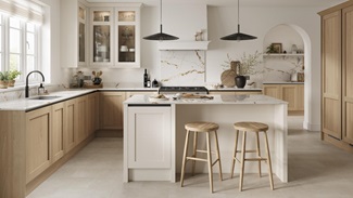 A handleless kitchen featuring oak and white shaker cabinets. It has quartz worktops, marble splashback, and stone flooring.