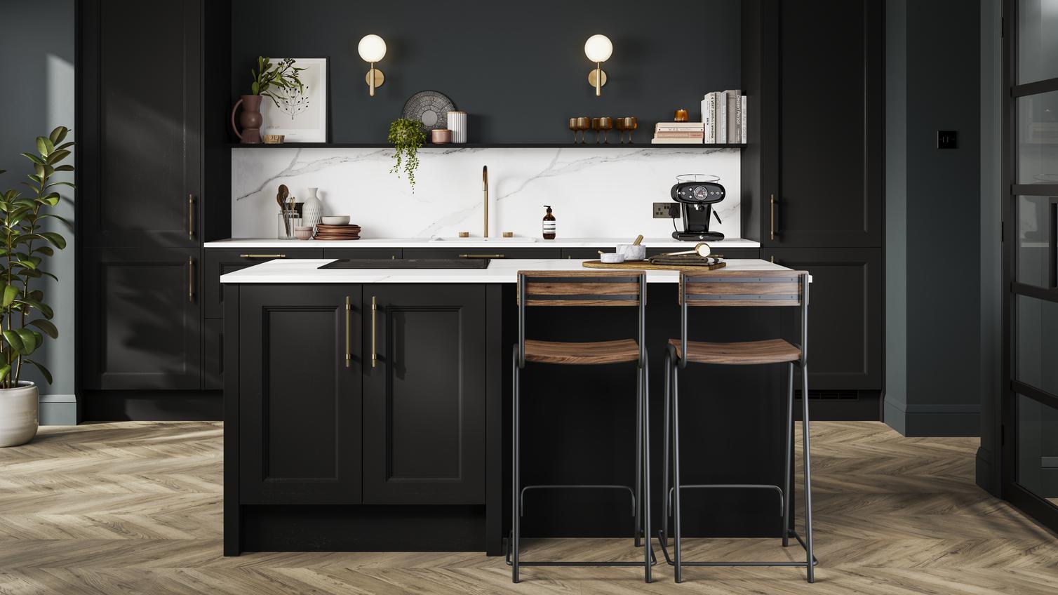 A charcoal black shaker kitchen in a single-wall layout, with island. There are white worktops and chevron oak flooring. 