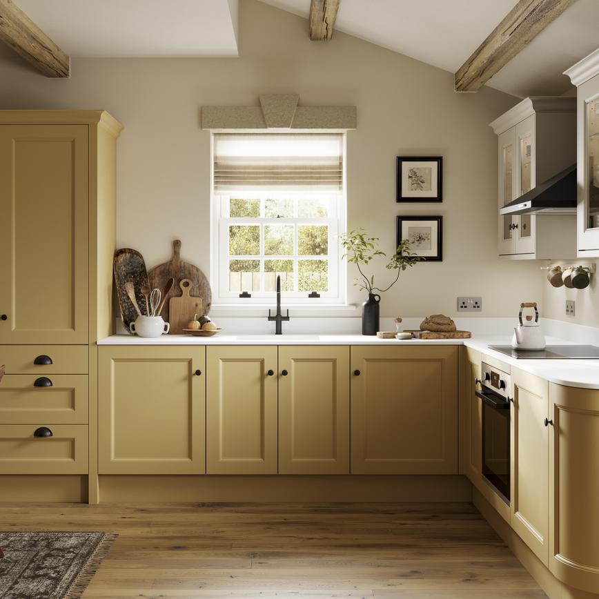 A saffron yellow shaker kitchen in an L-shaped layout, with single-plank flooring. The worktops and wall cabinets are white