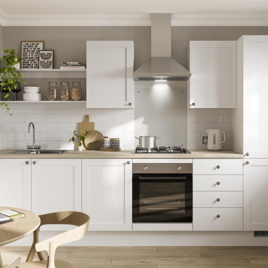 A white shaker kitchen design with classic features including an oak worktop and flooring, chrome handles and a chrome sink.