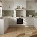 A porcelain coloured, shaker kitchen in a U-shaped layout. It has white worktops, green wall panelling, and plank flooring.