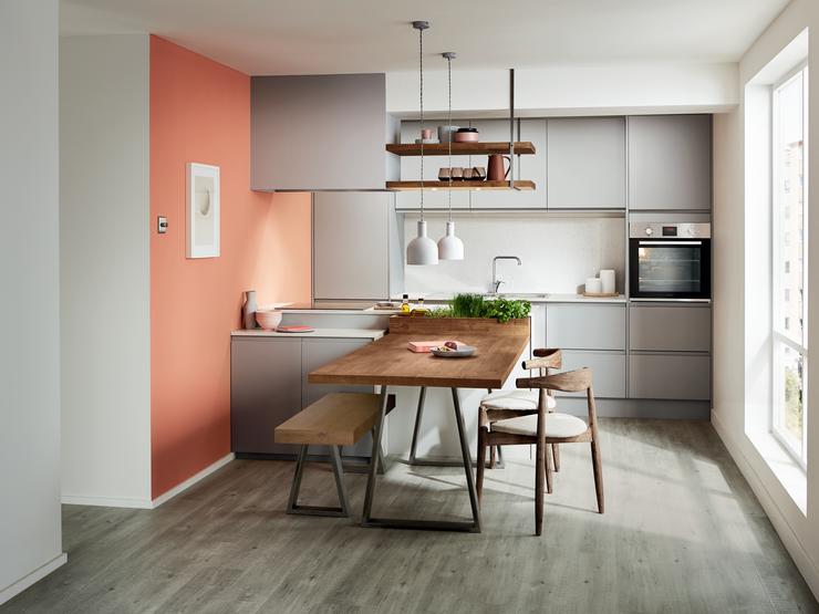 Contemporary grey super matt kitchen with mirror chip kitchen worktop, built in breakfast bar and appliance tower.