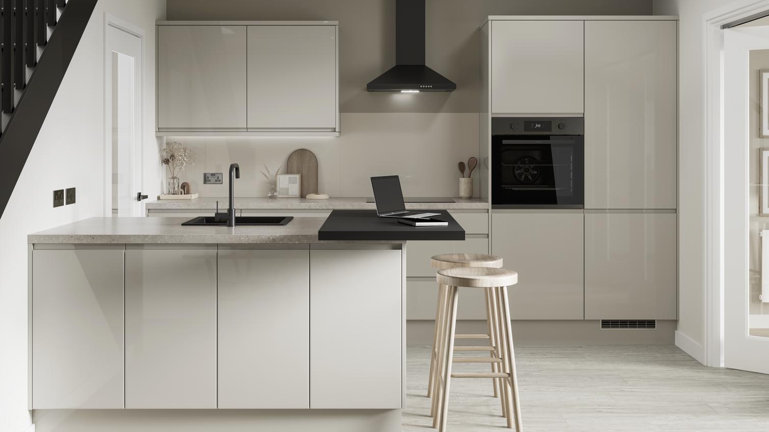 A minimal sandstone kitchen design with gloss, integrated handle doors and matt black features, such as a tap and extractor
