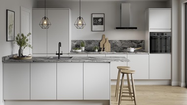 Modern dove grey kitchen with matt finish in an island layout. Includes dark grey counters and oak floors for a Scandi-style.