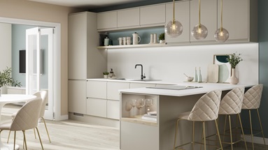A Scandi-inspired cooking space with integrated handle sandstone doors, a white worktop, and a flush-fitting induction hob.