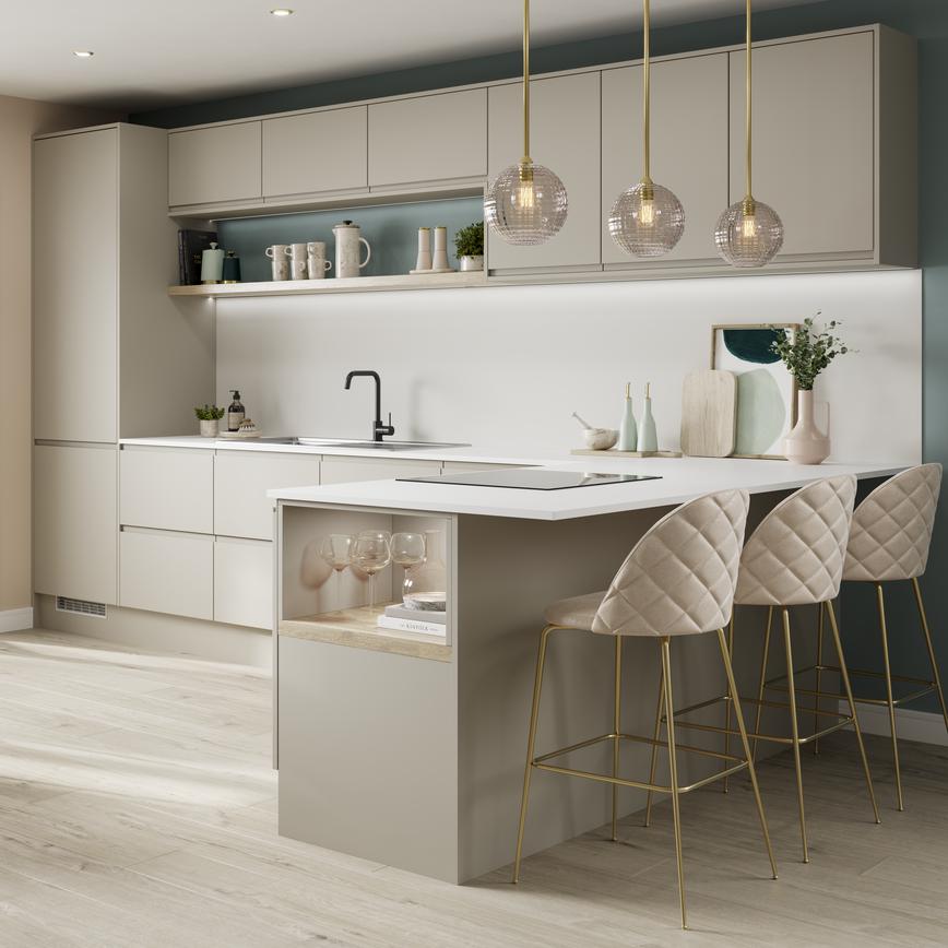 A Scandi-inspired cooking space with integrated handle sandstone doors, a white worktop, and a flush-fitting induction hob.