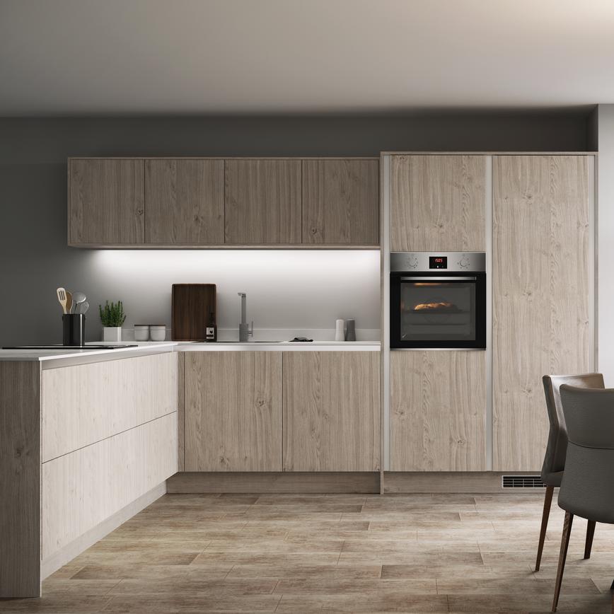 Light grey oak handleless kitchen in an l shape with wall cabinets along a single wall, white worktop and built in oven.