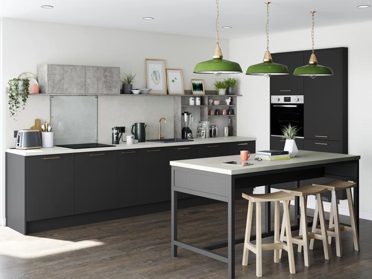 A mix and match black kitchen idea using charcoal and concrete-effect cabinets in a U-shaped layout. Includes white worktops.