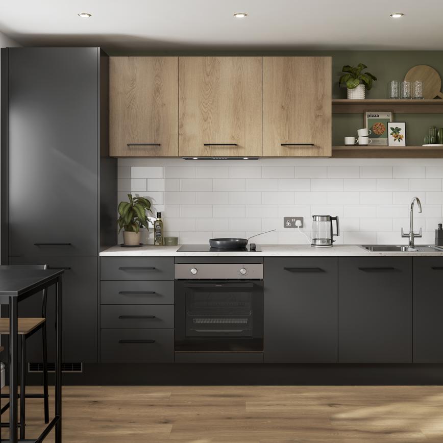 A contemporary black kitchen with matching black handles, oak-effect wall cabinet, and white counter in a single-wall layout