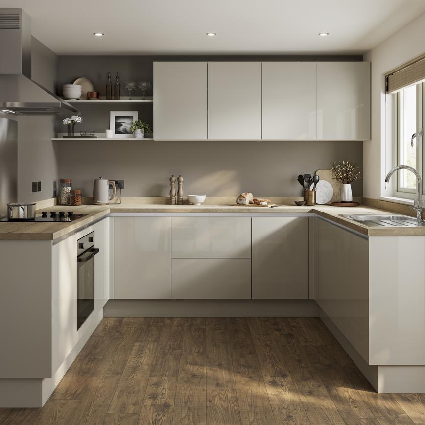 A minimal sandstone kitchen design with integrated handle doors, a warm wood worktop and floors, and chrome cooking devices