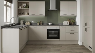 A sandstone kitchen design with gloss slab doors, chrome bar handles, a laminate stone-effect work surface, and chrome tap
