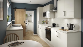 A porcelain, slab kitchen with a gloss finish in a galley layout. It has oak-effect flooring, integrated appliances and hob.