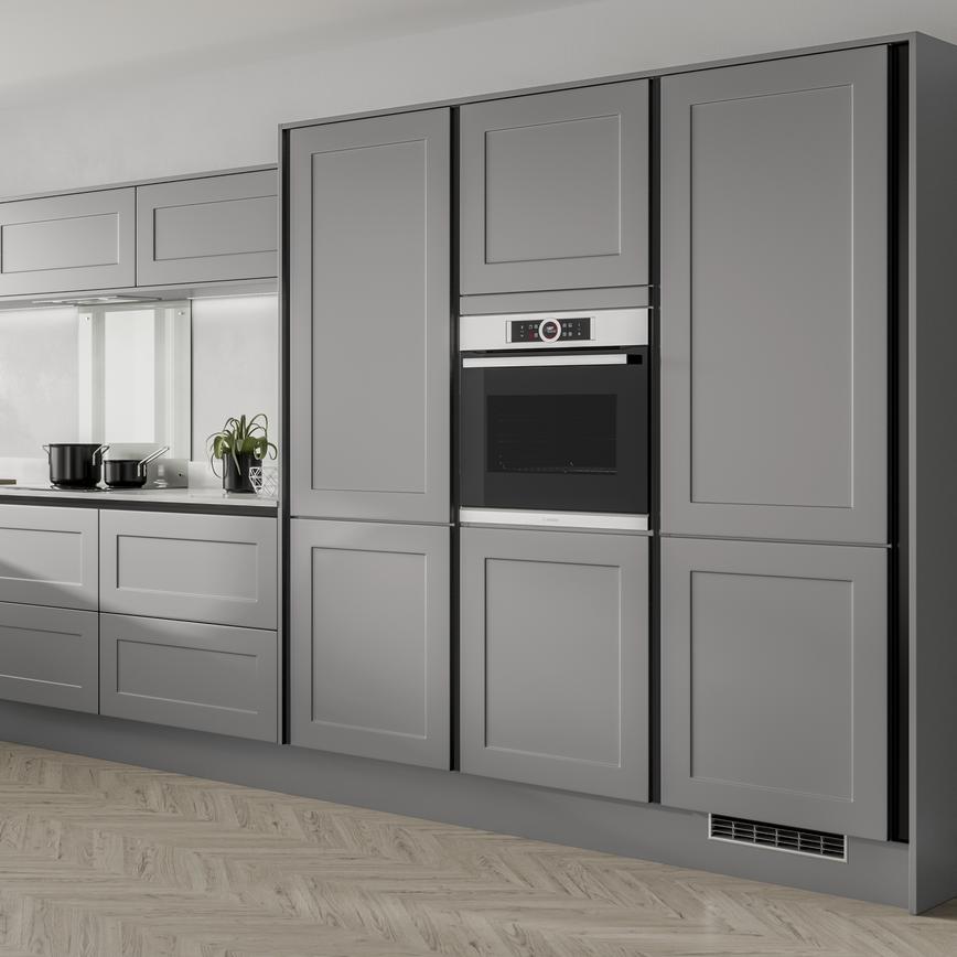 Modern L shaped slate grey shaker kitchen  with breakfast bar overhang, half height wall units and built in oven