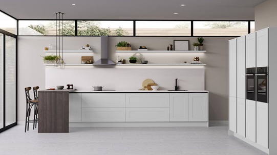 Modern white handleless shaker kitchen with full height tower units and side by side electric ovens