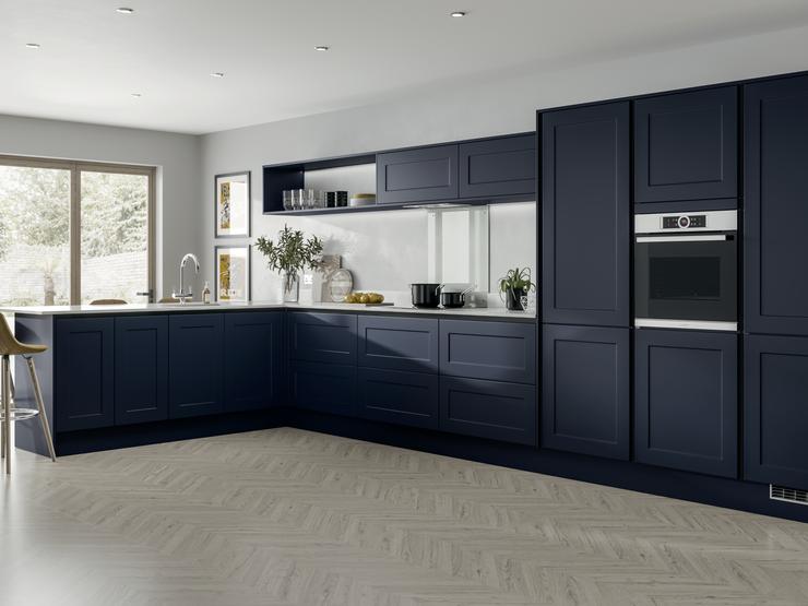 L-shape modern shaker style blue kitchen idea with handleless cabinets. Includes half-height wall units and open shelving