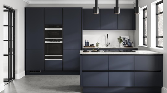 Linear-style navy kitchen with matt-black trims. A galley layout with white worktops, induction hob and built-in double oven.