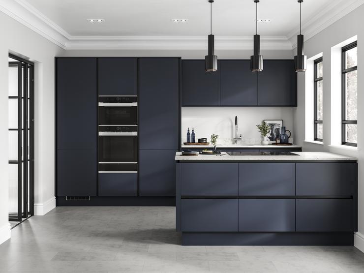 Linear-style navy kitchen with matt-black trims. A galley layout with white worktops, induction hob and built-in double oven.
