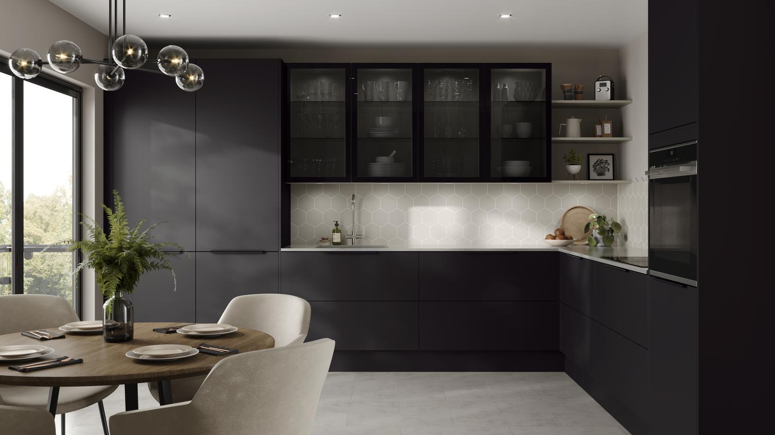 L-shape black kitchen idea with super-matt slab doors, glass wall cabinets above a white worktop, and a chrome kitchen tap.