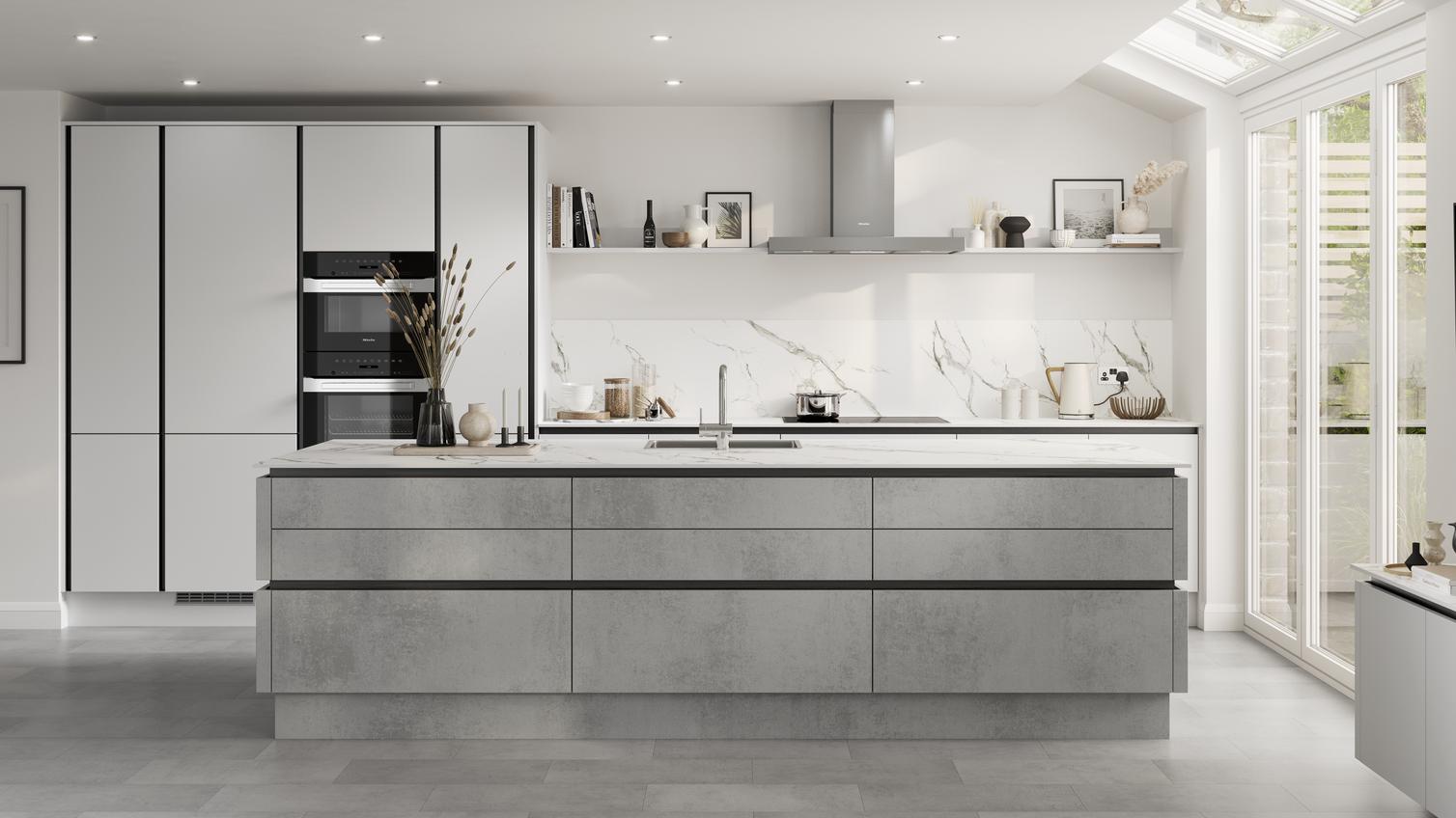 Open-plan kitchen with island and handleless concrete-effect doors. Contains matt-black metal trims for an industrious look.