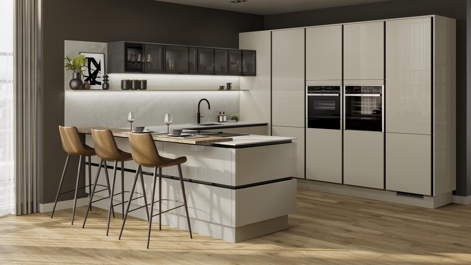 Peninsular kitchen layout with neutral slab doors in a glossy finish. Has handleless units and black trims for a modern look
