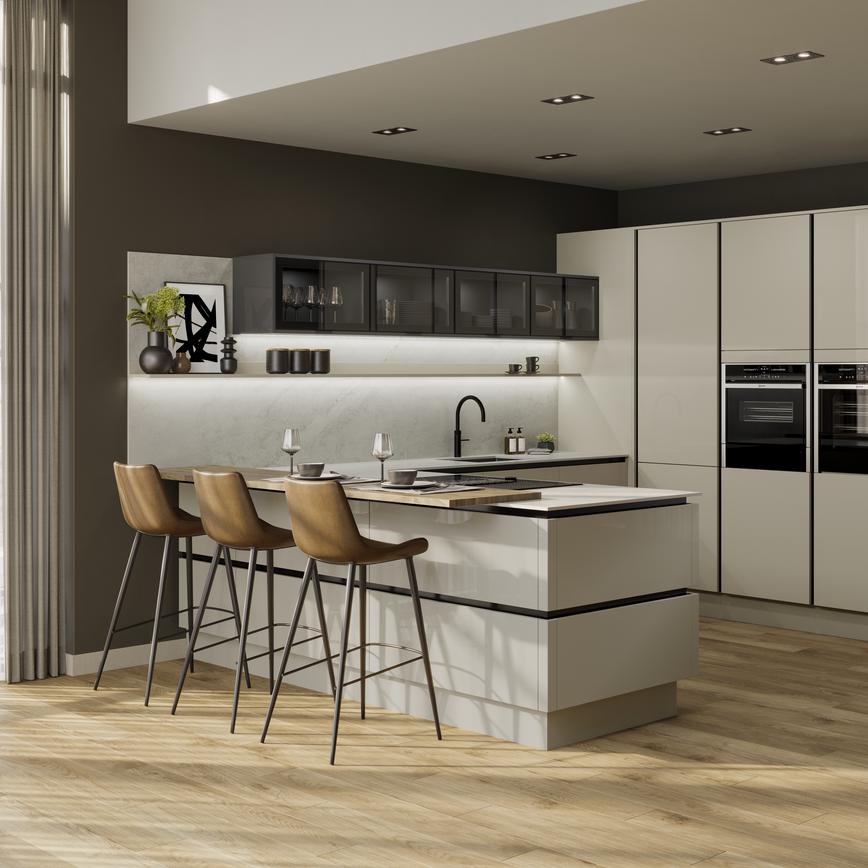 Peninsular kitchen layout with neutral slab doors in a glossy finish. Has handleless units and black trims for a modern look