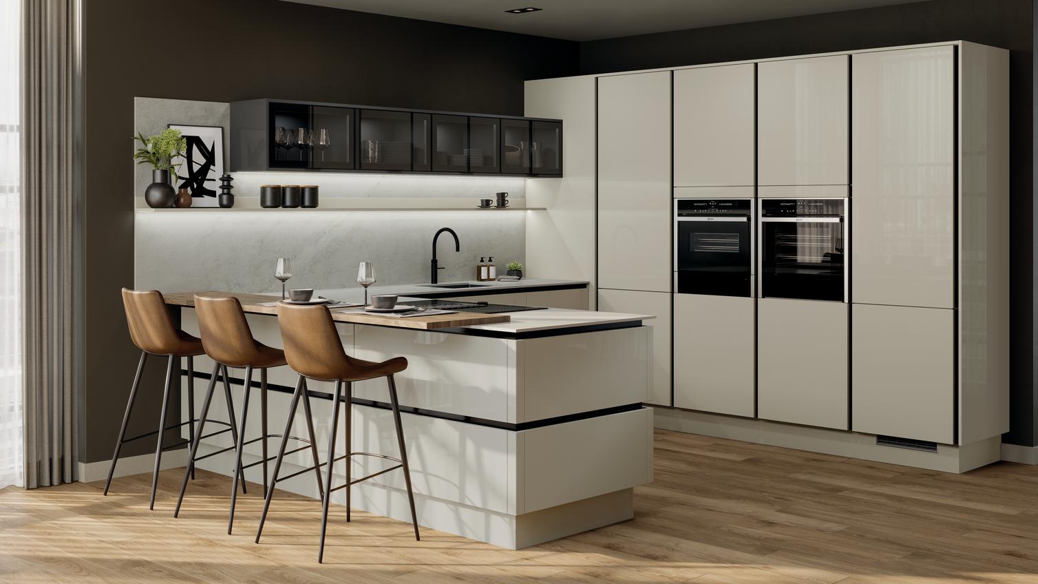 Peninsular kitchen layout with neutral slab doors in a glossy finish. Has handleless units and black trims for a modern look.