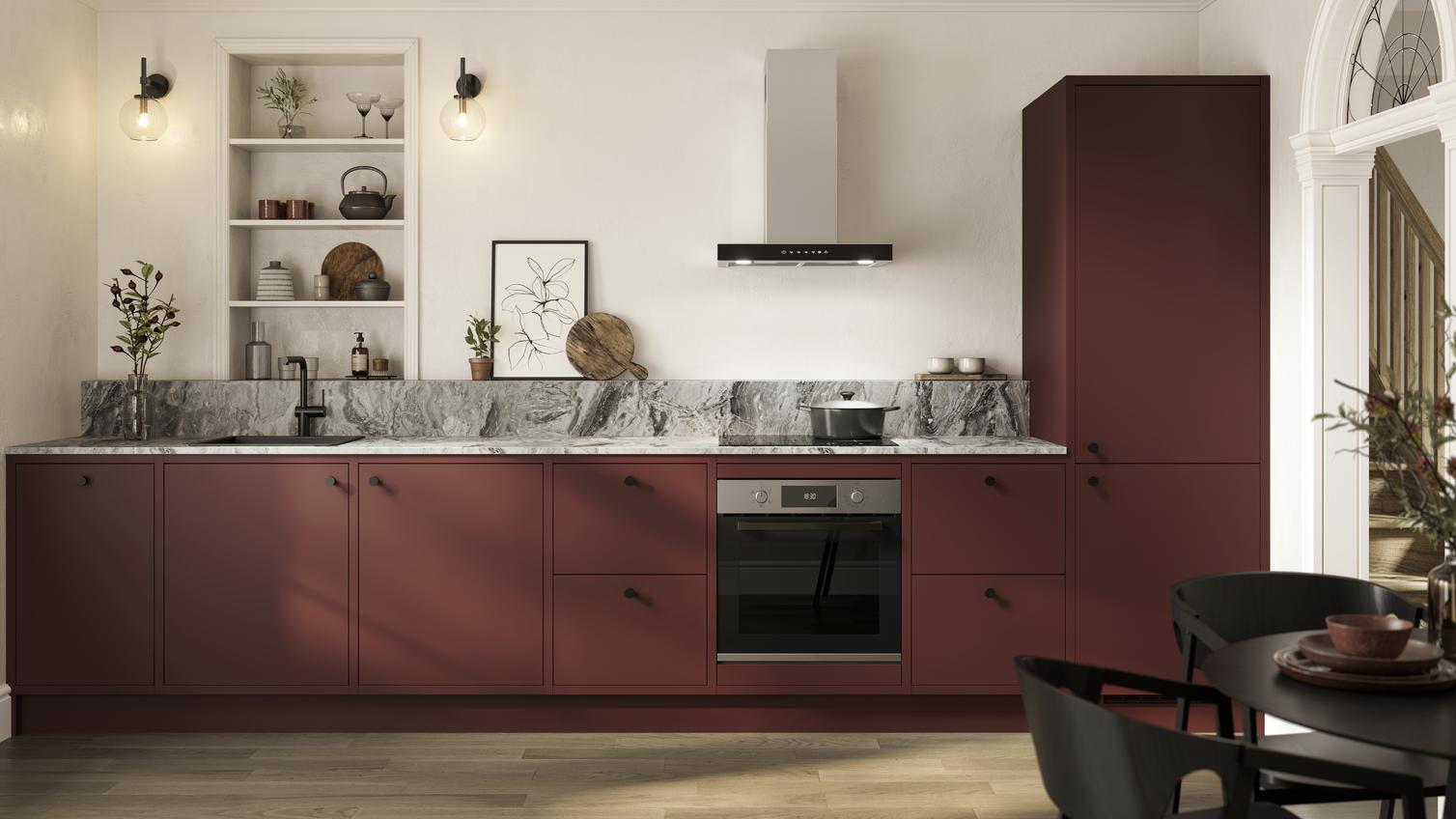 Garnet red kitchen in a single-wall layout with in-frame detailed cabinetry. Includes grey marble-effect counter and upstand.