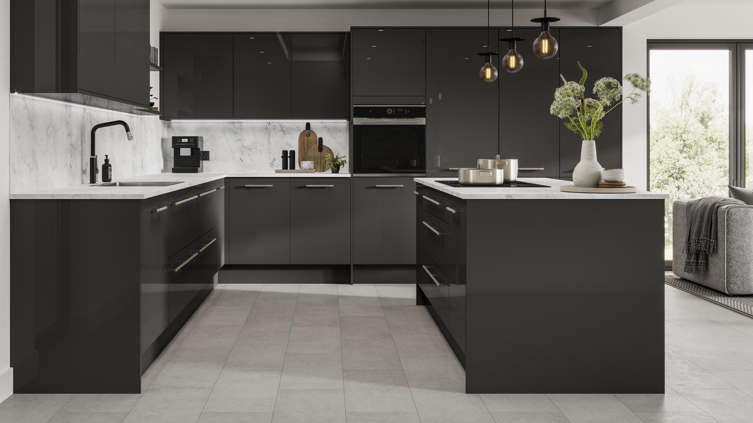 Black kitchen in an island layout with glossy slab cupboard doors, white worktops, and backboards for a monochrome look.