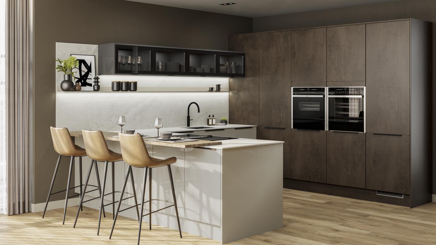 A contemporary two-tone kitchen with dark stone, cream slab doors, black handles, glazed wall units, and timber floors