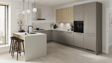 A gloss modern kitchen in a peninsula layout and sand grey colour. It has a white breakfast bar and integrated appliances.