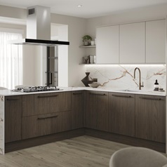 An l-shaped kitchen with cabinets in texted, walnut tones and white larder doors. It has marble worktops and backsplash.