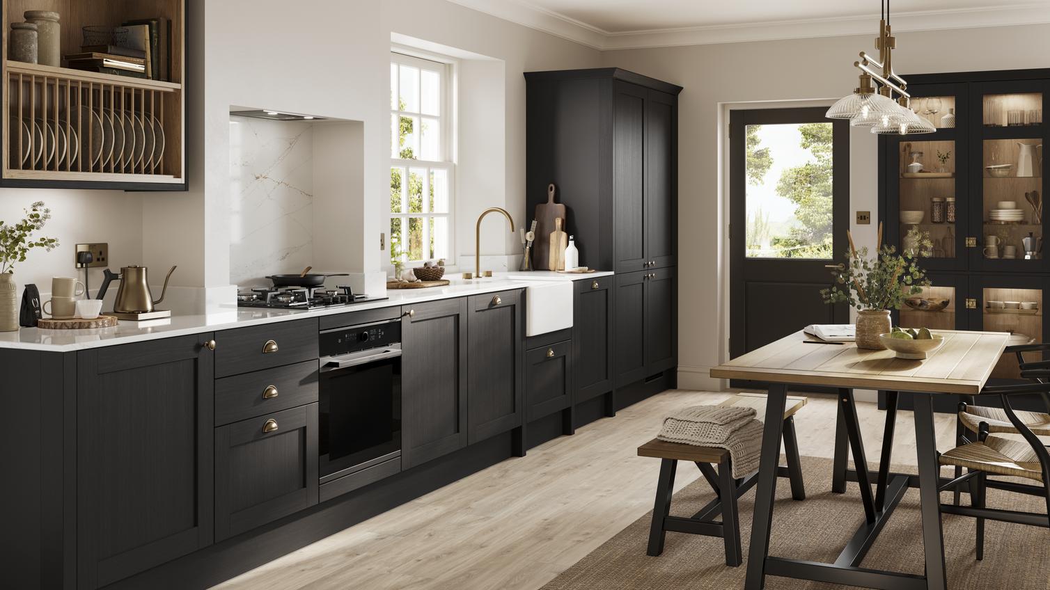 Black, charcoal-coloured shaker kitchen from the Halesworth range. In a single wall layout with hob, oven and glass cabinets