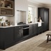 Black, charcoal-coloured shaker kitchen from the Halesworth range. In a single wall layout with hob, oven and glass cabinets